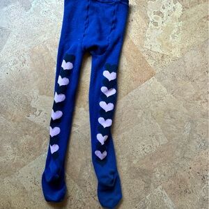 Cute blue tights with black and pink hearts across the back
